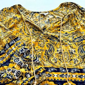 Lucky Brand long sleeve top. Detailed sleeve, with tassel neckline. Gorgeous!